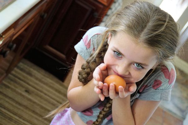 adorable little girl with an egg