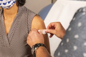Women getting vaccine shot