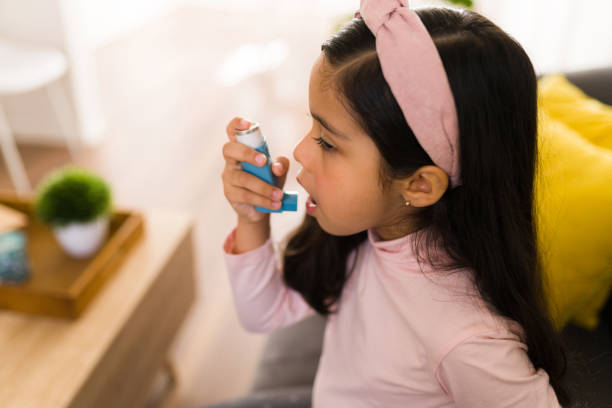Young Girl using inhaler