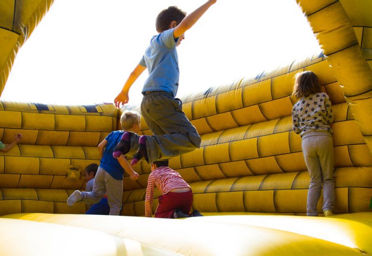 kids jumping in bounce house