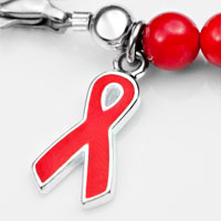 red ribbon charm aids awareness